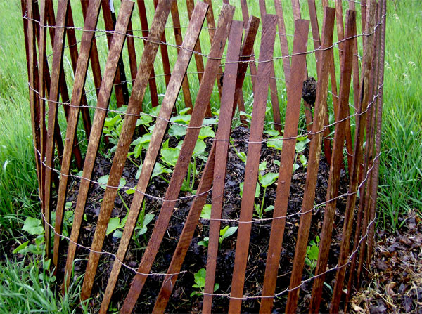 a snow fence used around a compost pile