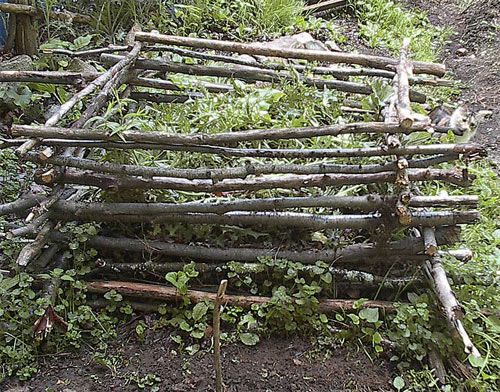 common sticks from the woods to hold a compost pile